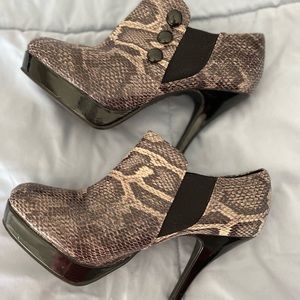 Heeled ankle snakeskin boots.